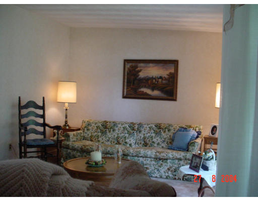 29 Griffin Road Framingham, MA 01701 - Photo 11 of 14 a living room with furniture and a lamp