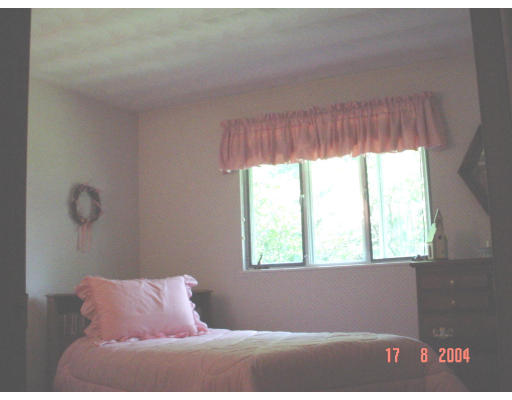 29 Griffin Road Framingham, MA 01701 - Photo 4 of 14 a bedroom with a window and a bed