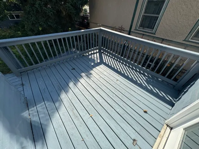 a view of balcony with wooden floor