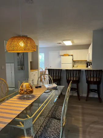 a hallway with a table and chairs