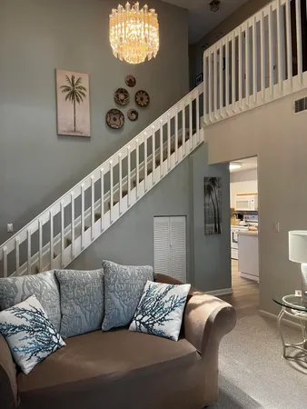 a living room with furniture and windows