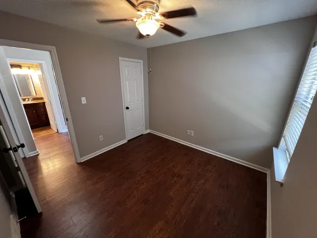 wooden floor in an empty room with a mirror
