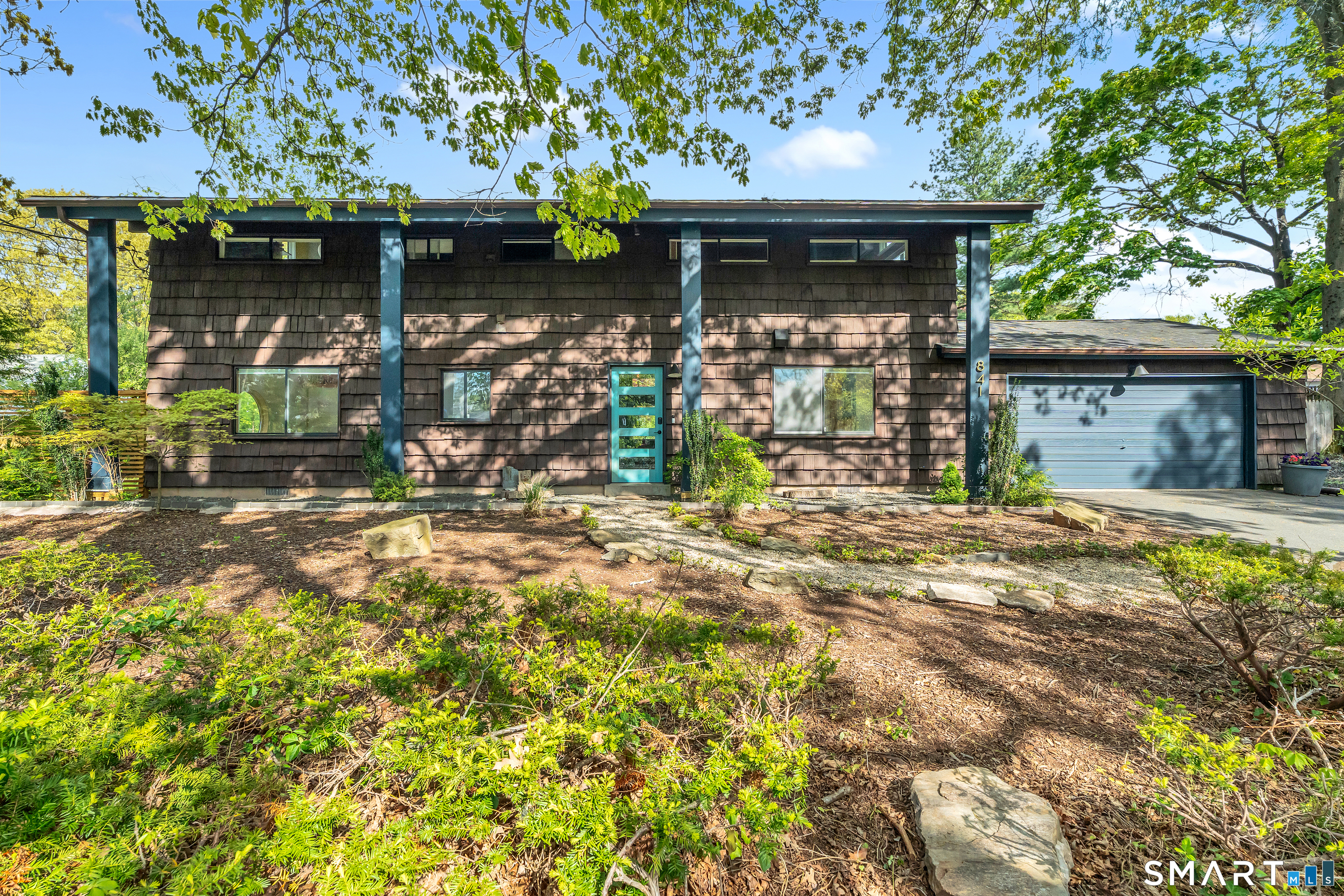 841 Prospect Street Hamden, CT 06517 - Photo 35 of 40 a front view of a house with lots of green space