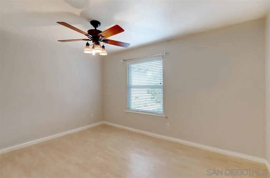 13856 Olive Grove Place Poway, CA 92064 - Photo 13 of 25 an empty room with windows and fan