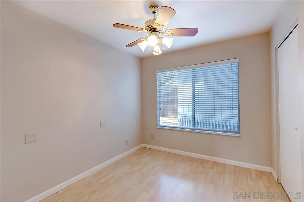 13856 Olive Grove Place Poway, CA 92064 - Photo 15 of 25 an empty room with a window and a ceiling fan
