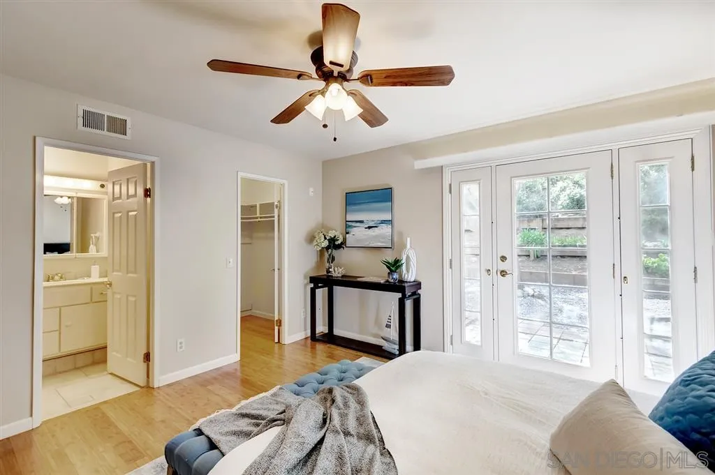 13856 Olive Grove Place Poway, CA 92064 - Photo 17 of 25 a bedroom with furniture and a window