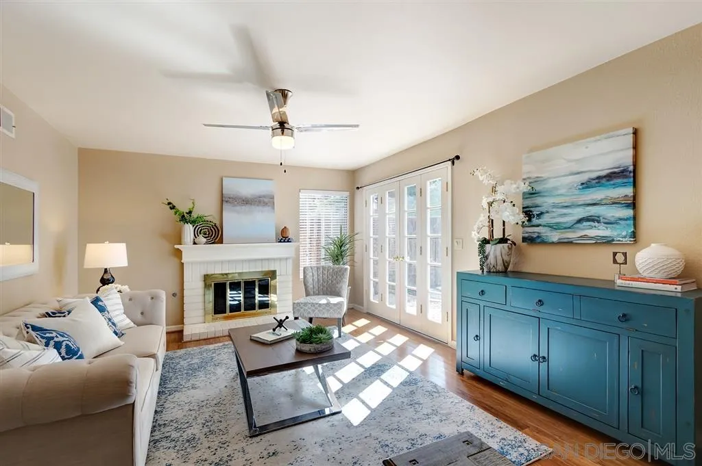 13856 Olive Grove Place Poway, CA 92064 - Photo 3 of 25 a living room with furniture and a fireplace
