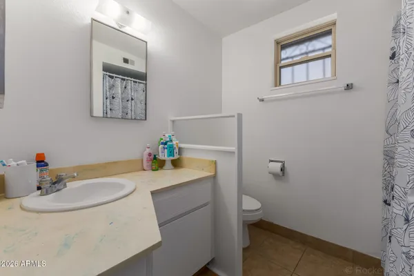 a bathroom with a sink and a toilet