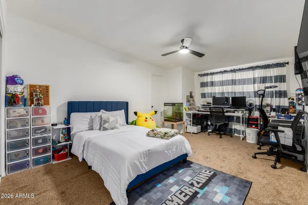 a bed room with a bed furniture and a window