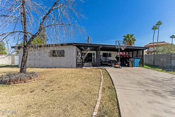 a house view with a wooden fence