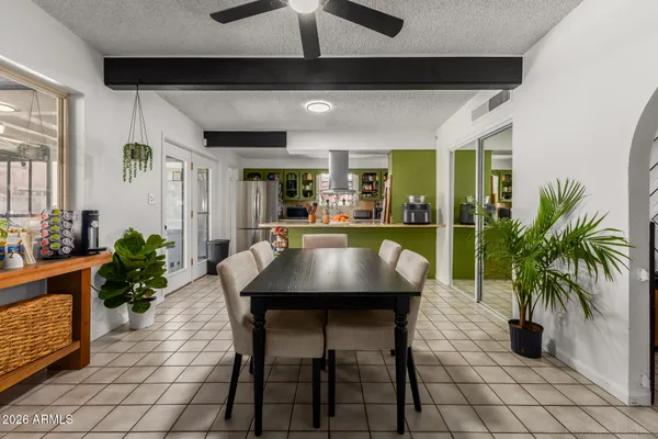 a kitchen with a table and chairs