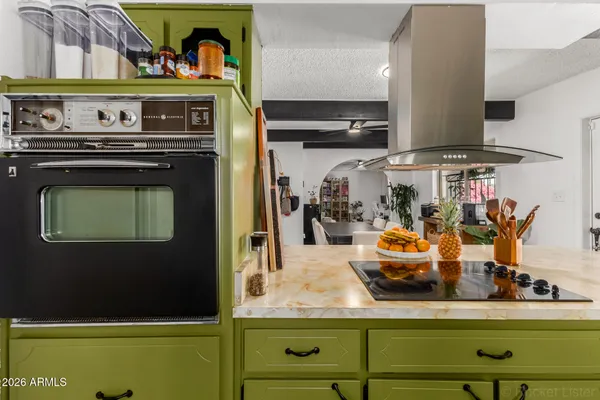a kitchen with a stove and a microwave