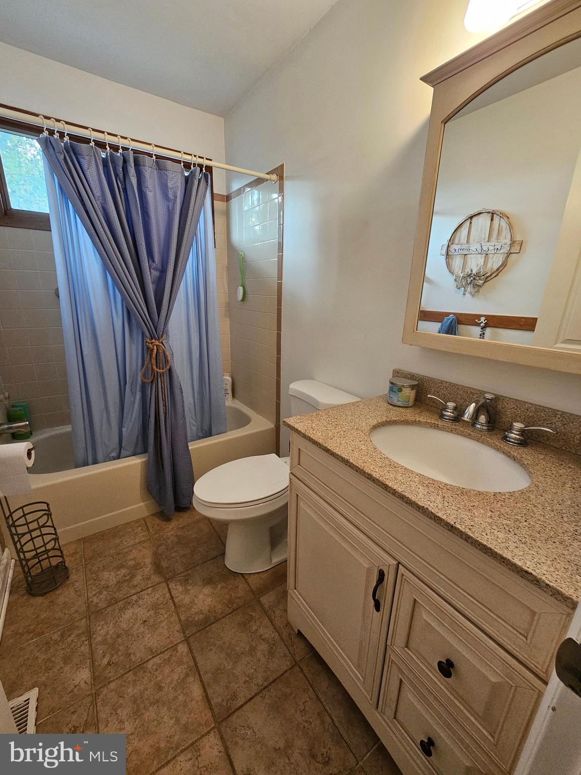 82 Basin Road Earleville, MD 21919 - Photo 33 of 46 a bathroom with a granite countertop sink toilet and shower