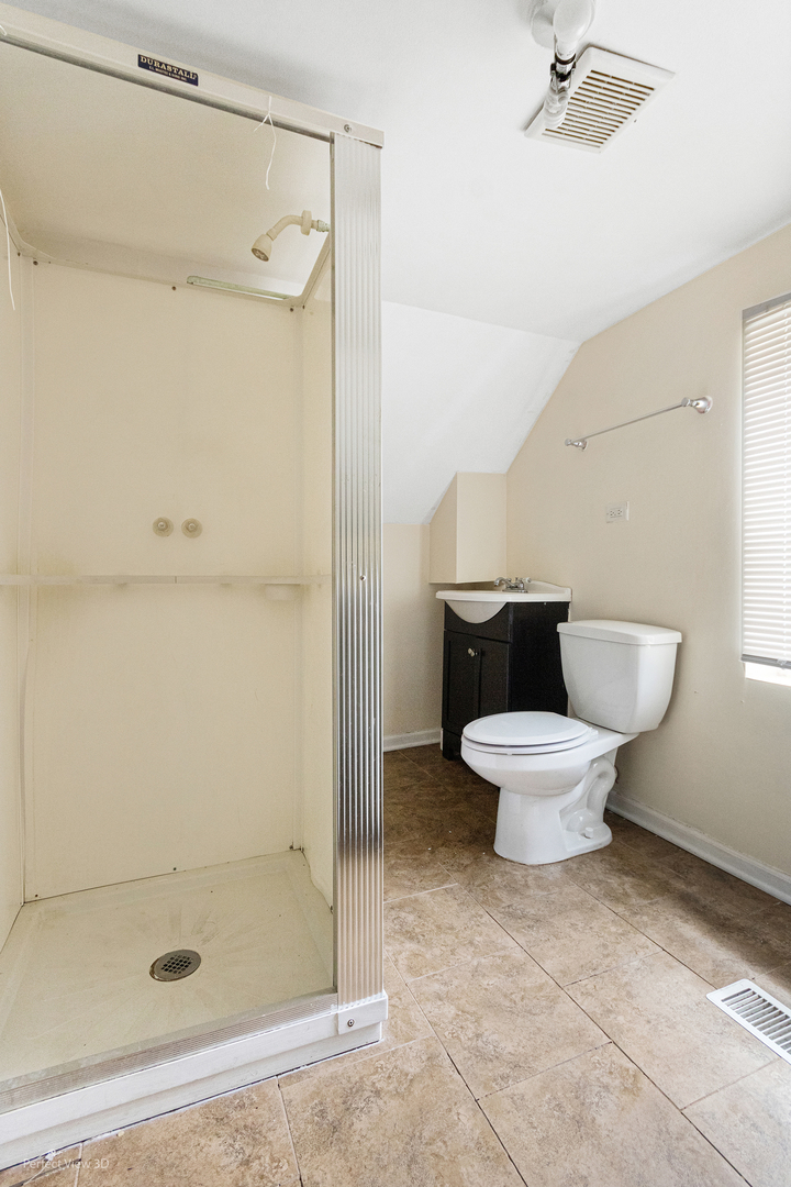 328 North Addison Road Wood Dale, IL 60191 - Photo 18 of 22 a white toilet sitting next to a bathroom sink