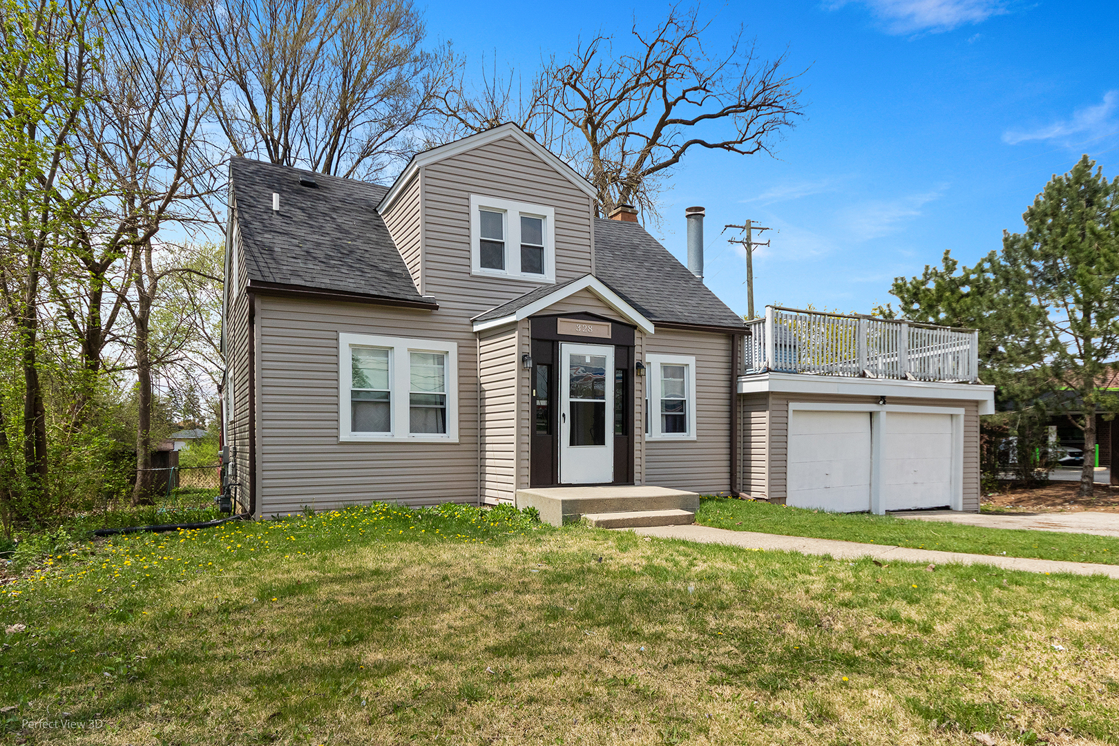 328 North Addison Road Wood Dale, IL 60191 - Photo 2 of 22 a front view of a house with a garden