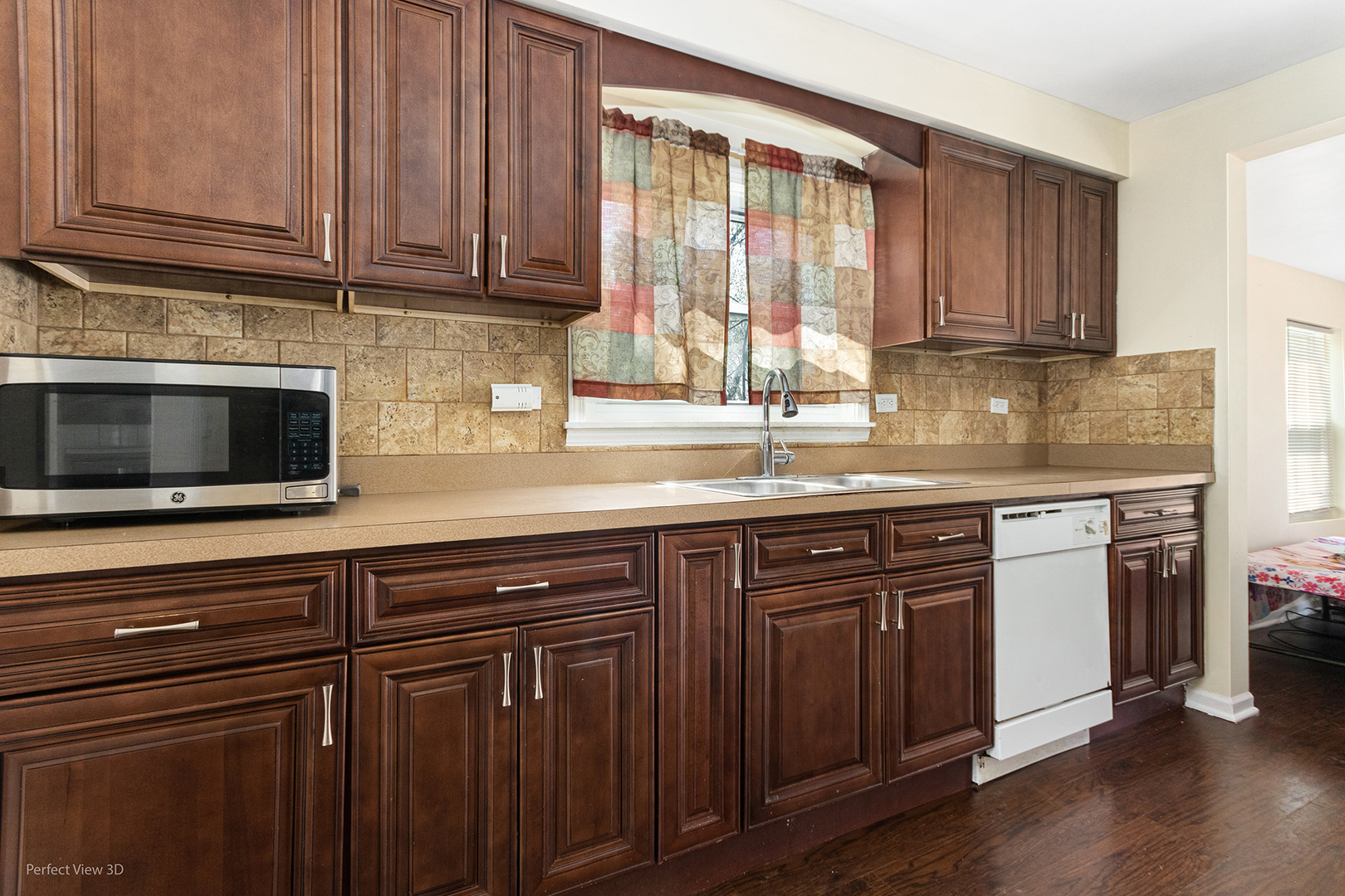 328 North Addison Road Wood Dale, IL 60191 - Photo 7 of 22 a kitchen with granite countertop wooden cabinets a sink and dishwasher