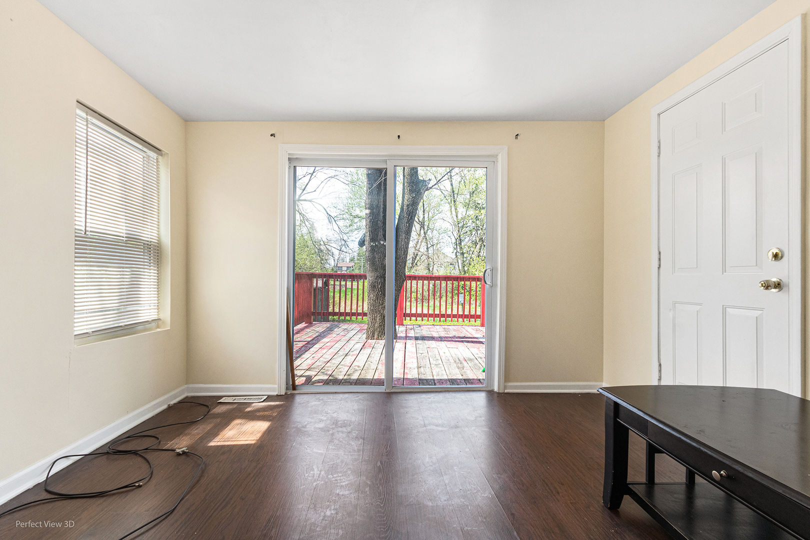 328 North Addison Road Wood Dale, IL 60191 - Photo 10 of 22 a view of an empty room with wooden floor and a window