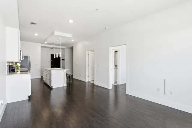 a view of kitchen with furniture and wooden floor