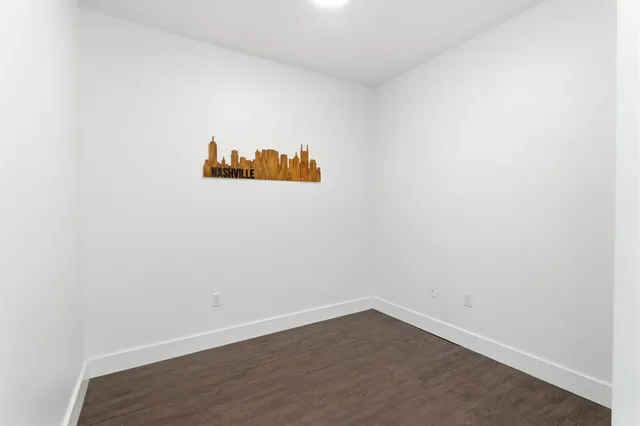 a view of a small space with wooden floor