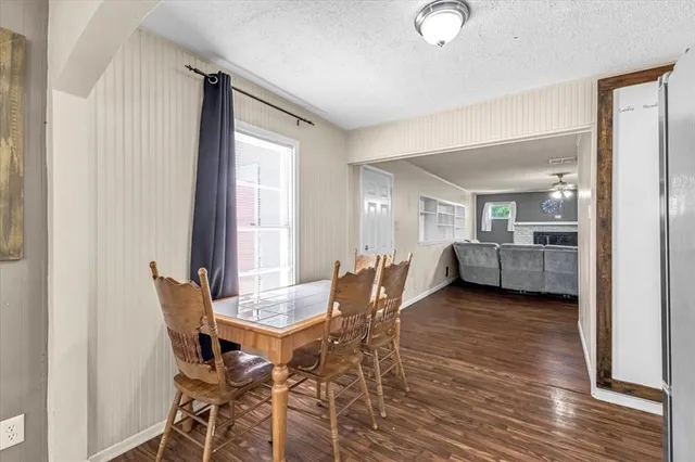 a view of a dining room with furniture and window