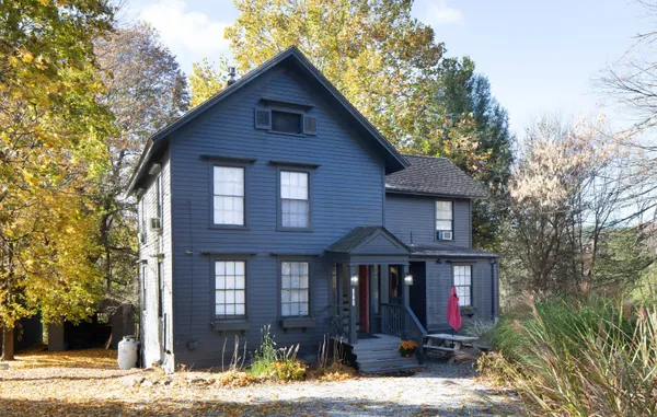 a front view of a house with yard