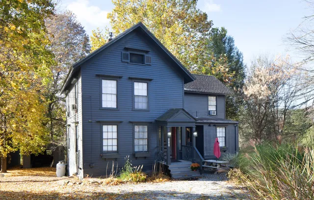 a front view of a house with yard