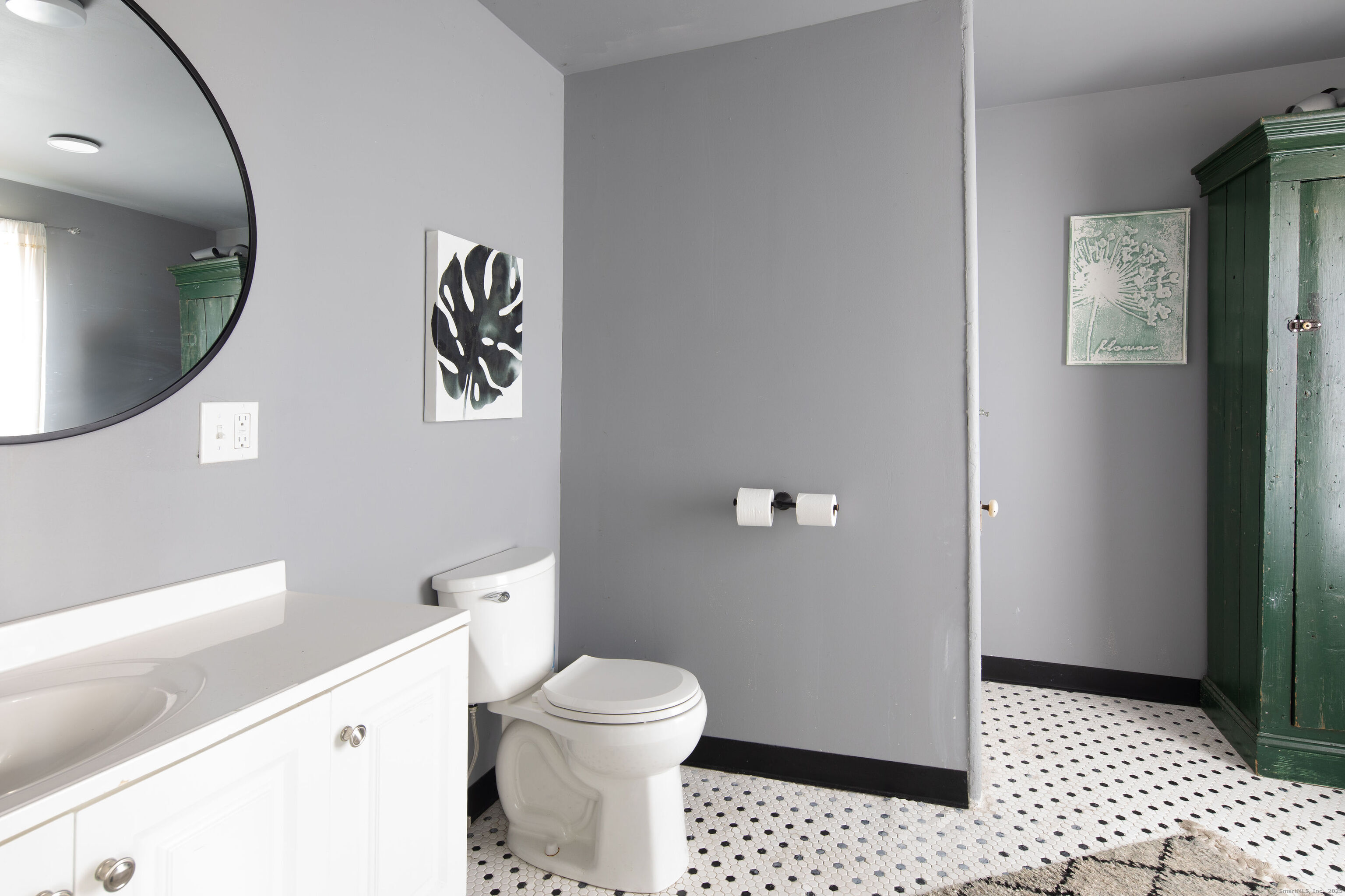 471 Lime Rock Road Salisbury, CT 06039 - Photo 13 of 24 a bathroom with a toilet and a mirror