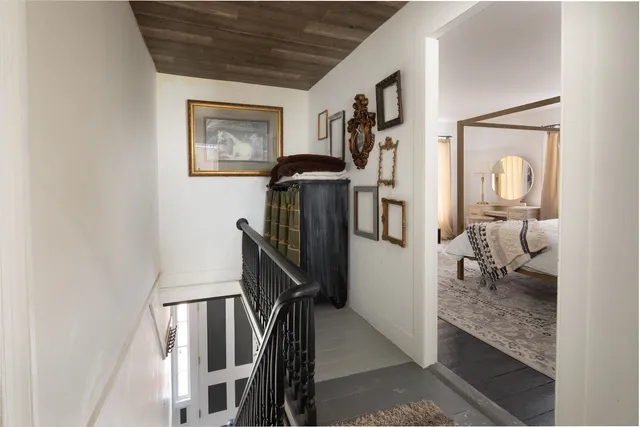 a living room with furniture and a walk in closet