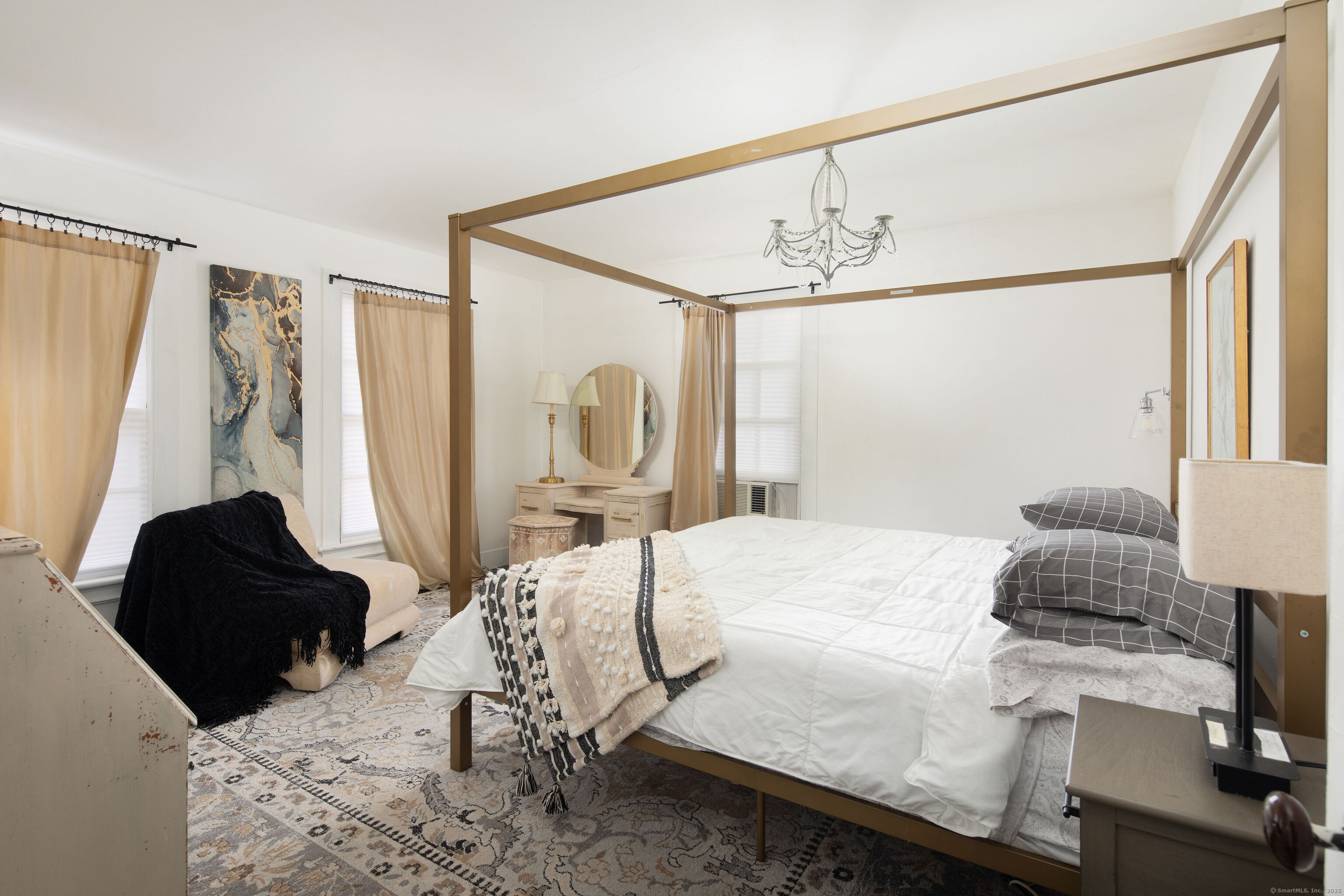 471 Lime Rock Road Salisbury, CT 06039 - Photo 17 of 24 a bedroom with a bed next to a window with the outer view