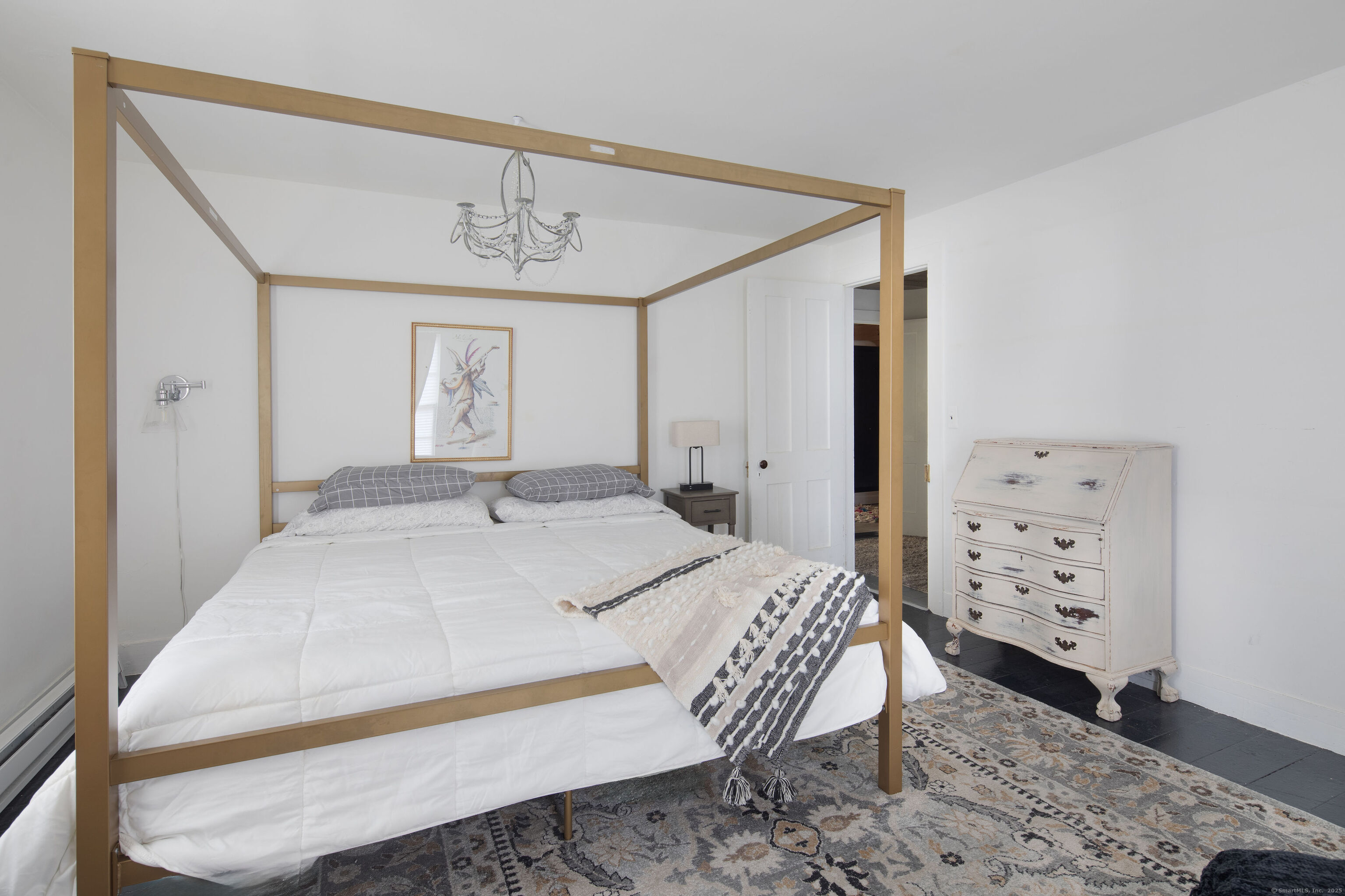 471 Lime Rock Road Salisbury, CT 06039 - Photo 18 of 24 a bedroom with a bed a dresser and decor