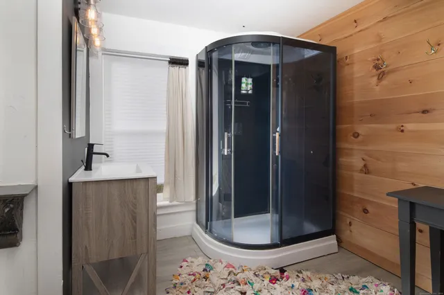 a view of a bathroom with mirror