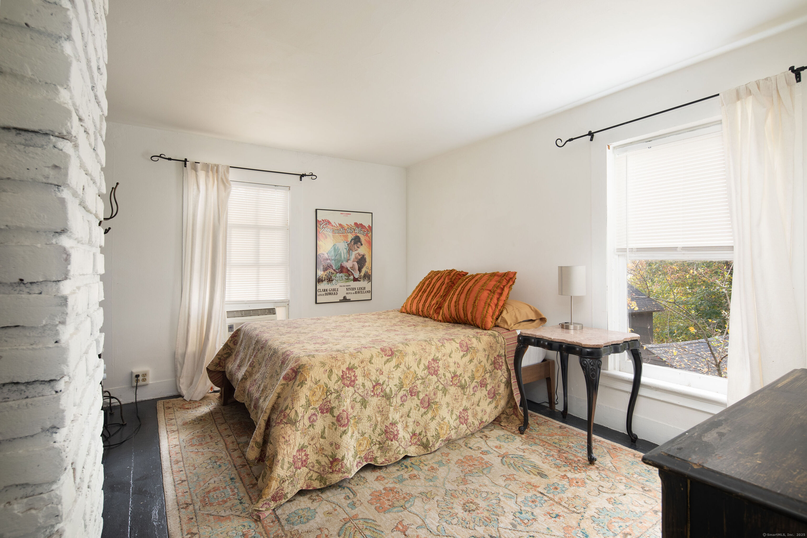 471 Lime Rock Road Salisbury, CT 06039 - Photo 20 of 24 a bedroom with a bed and a table in it