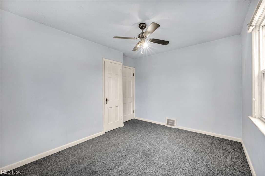 3946 Lansdale Road Cleveland, OH 44118 - Photo 34 of 42 Empty room featuring dark carpet and ceiling fan