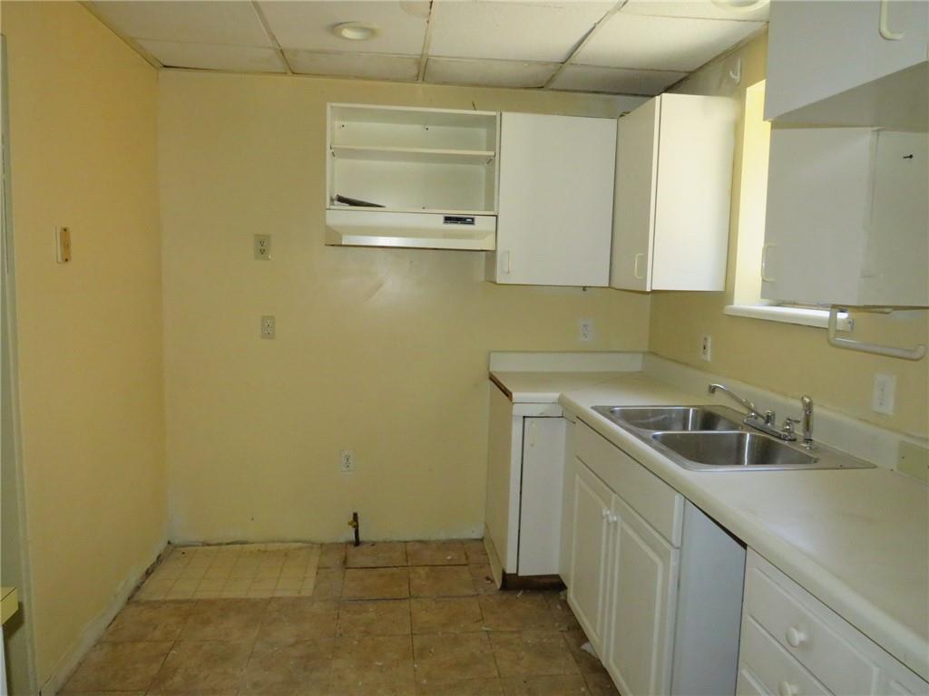 423 Braddock Road Pittsburgh, PA 15221 - Photo 13 of 36 a kitchen with a sink and cabinets