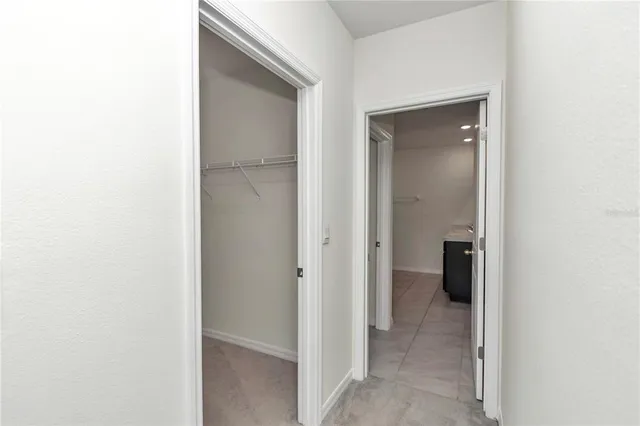 a bathroom with a tub shower and toilet