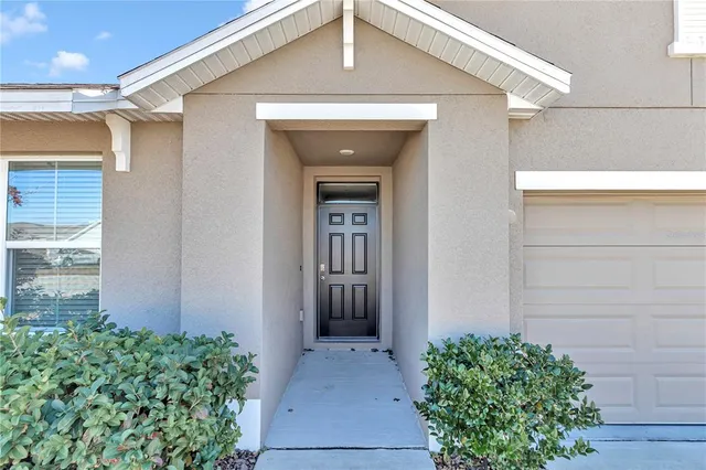 a front view of a house with a garage