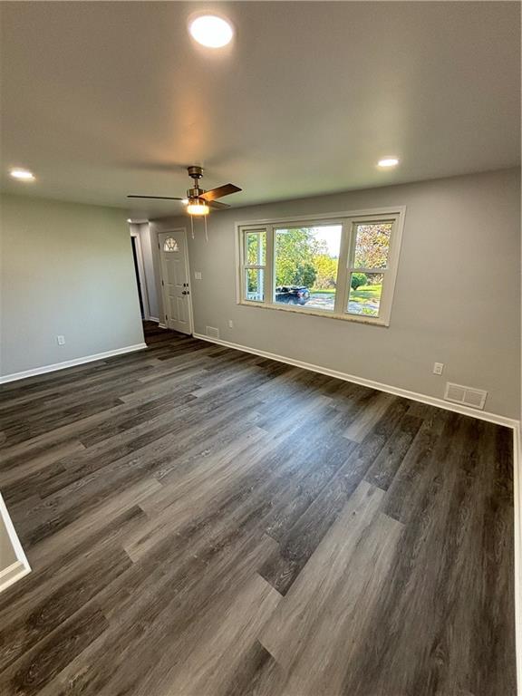 408 Highview Street Latrobe, PA 15650 - Photo 14 of 50 an empty room with wooden floor chandelier and windows