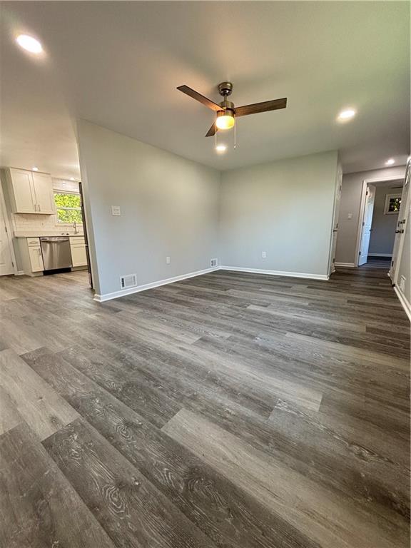 408 Highview Street Latrobe, PA 15650 - Photo 15 of 50 an empty room with wooden floor fan and windows