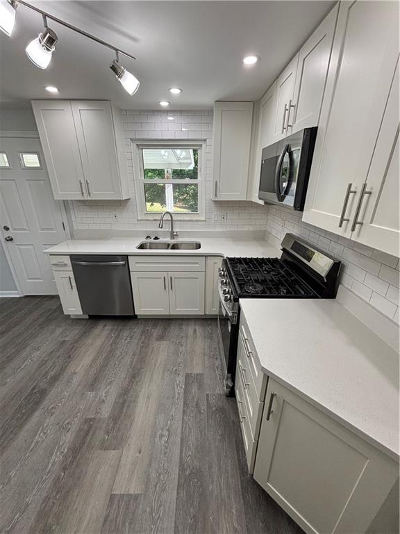408 Highview Street Latrobe, PA 15650 - Photo 17 of 50 a kitchen with a sink and wooden floor