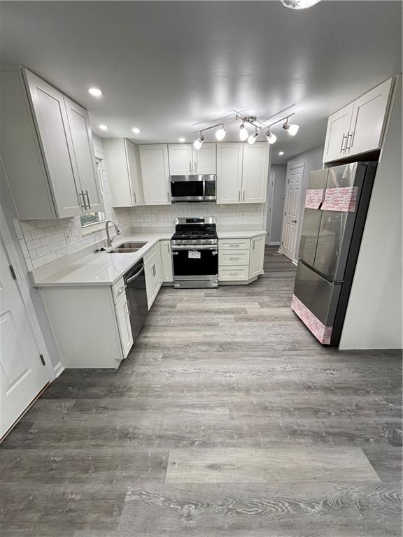 408 Highview Street Latrobe, PA 15650 - Photo 22 of 50 a large kitchen with a stove a sink dishwasher and a refrigerator