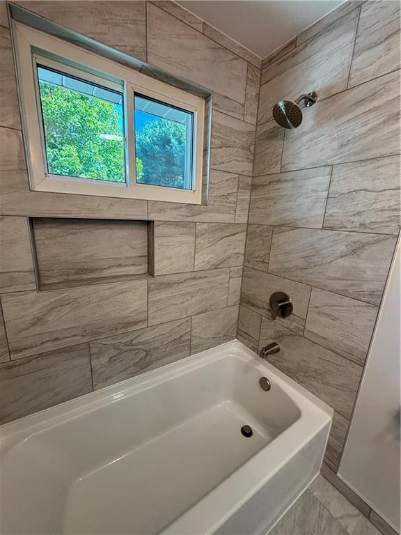 408 Highview Street Latrobe, PA 15650 - Photo 27 of 50 a bathroom with a tub a window and a shower