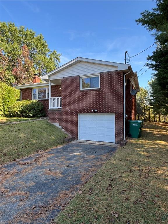408 Highview Street Latrobe, PA 15650 - Photo 4 of 50 a view of a house with yard and a garage