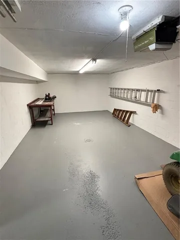 a hallway with a table and a couch