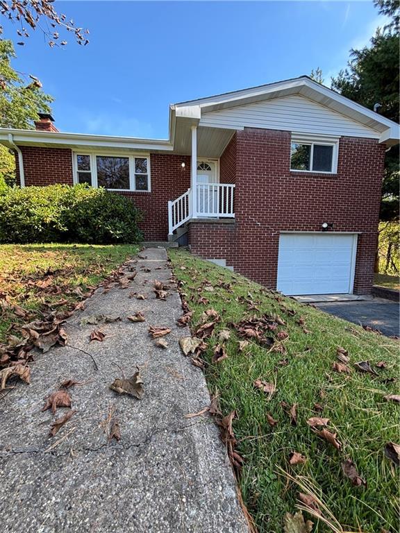 408 Highview Street Latrobe, PA 15650 - Photo 5 of 50 a front view of a house with garden