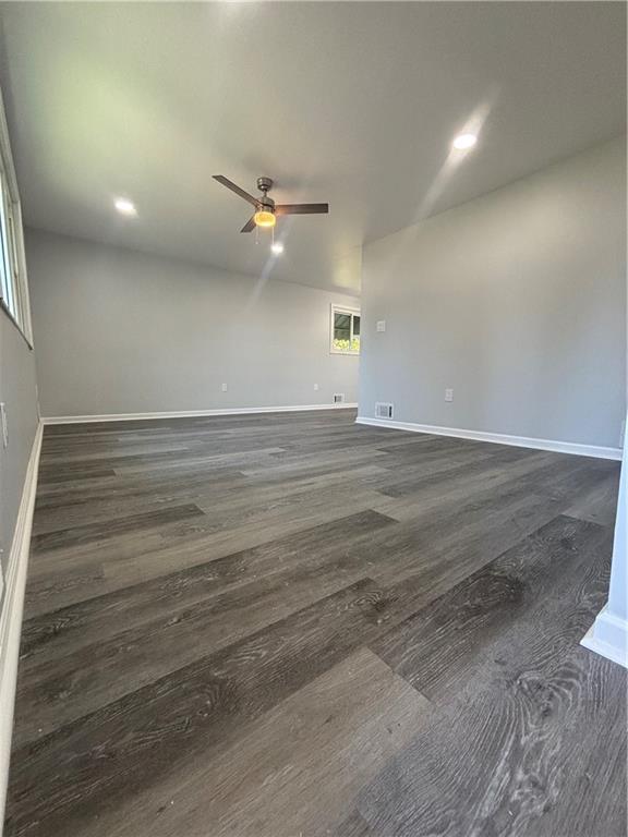 408 Highview Street Latrobe, PA 15650 - Photo 10 of 50 an empty room with wooden floor fan and windows