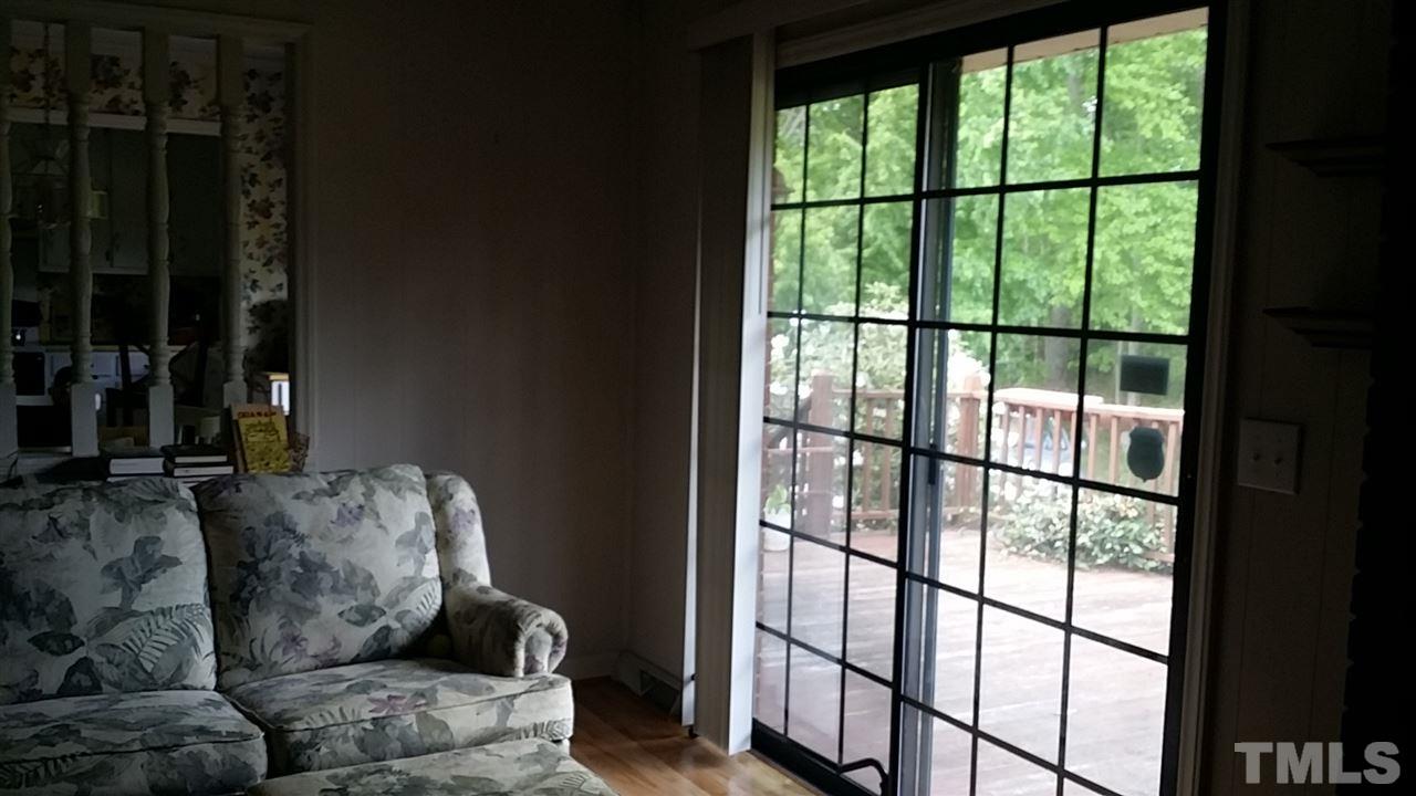 2707 McDade Store Road Cedar Grove, NC 27231 - Photo 16 of 25 Bright family room has slider onto deck that overlooks private and large yards