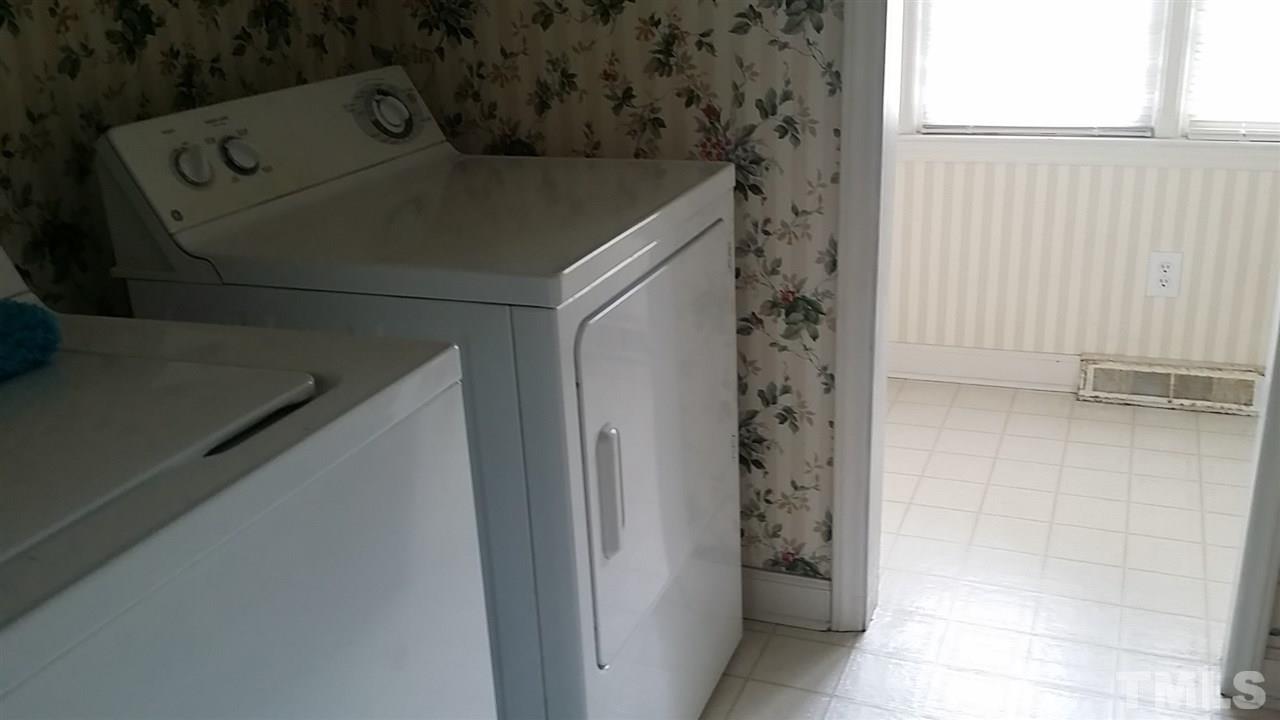2707 McDade Store Road Cedar Grove, NC 27231 - Photo 24 of 25 Perfect for country living - come in side door through garage, peel off the dirty clothes, throw in the wash and step into the adjoining bath with shower.