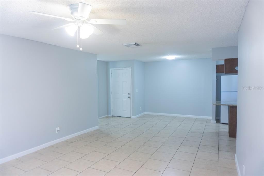 237 Thorntree Place, Unit 237 Brandon, FL 33510 - Photo 11 of 58 wooden floor in an empty room with a window