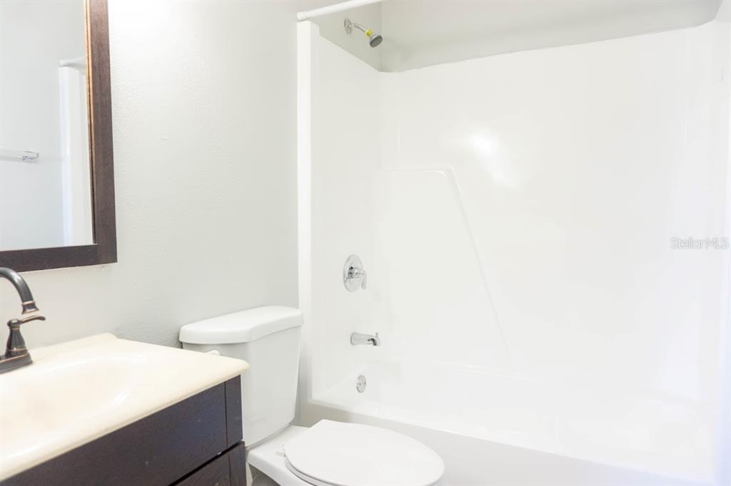 237 Thorntree Place, Unit 237 Brandon, FL 33510 - Photo 22 of 58 a white toilet sitting next to a bathroom sink