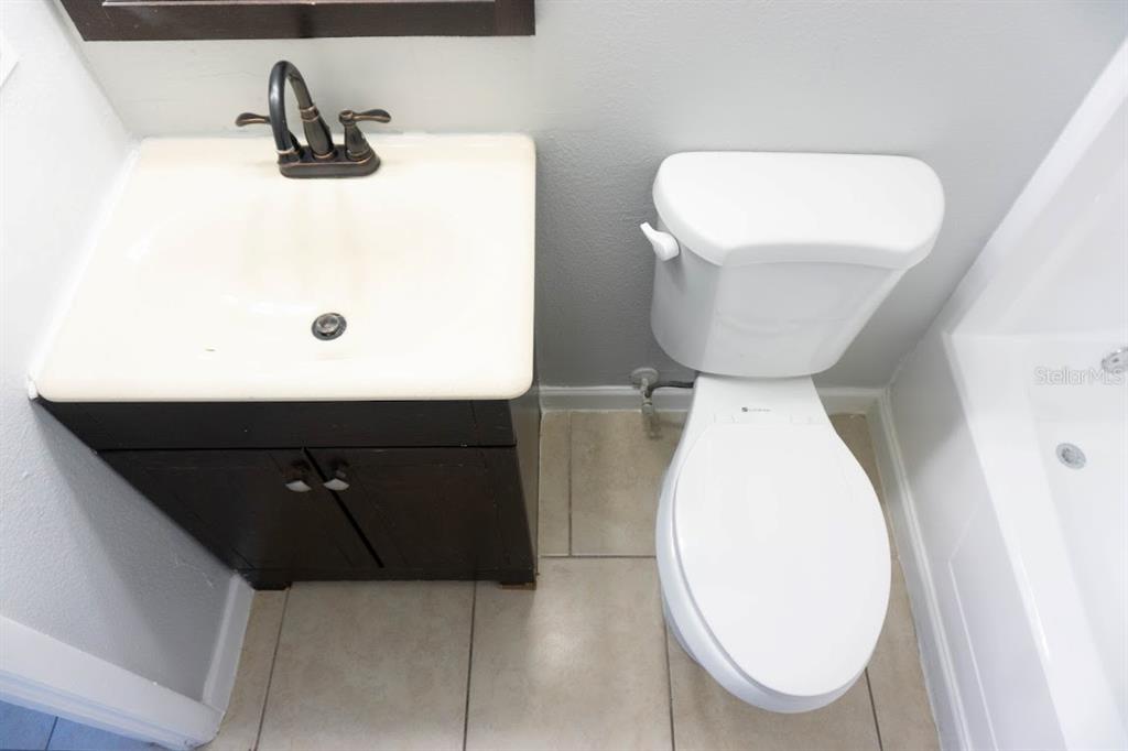 237 Thorntree Place, Unit 237 Brandon, FL 33510 - Photo 24 of 58 a bathroom with a toilet and a sink